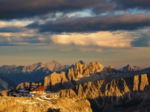 Alpenglühen, Rifugio Lagazuoi and rugged Dolomite peaks in the evening light, Dolomites, Alps,