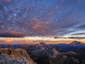 Alpenglühen, Rifugio Lagazuoi and rugged Dolomite peaks at sunset, Monte Pelmo in the middle,