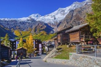Typical granaries on the outskirts of the village with Alphubel 4206m and Mischabel group 4545m in