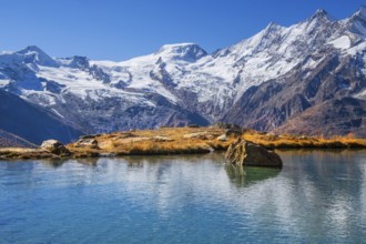 Kreuzbodensee with Alalin 4027 m, Alphubel 420 6 m and Mischabel Group 4545 m in autumn,