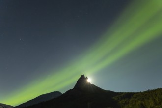 National mountain of Norway - Stetind in the Nordland under auroras and a full moon