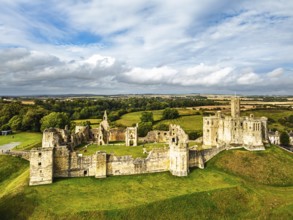 Warkworth Castle over River Coquet from a drone, Warkworth, Northumberland, England, United Kingdom