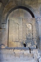 Stone reliefs and decorated arches in historic church, Noravank monastery, Surb Karapet Anabaptist