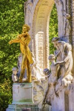 The gilded bronze statue of Johann Strauss, the Waltz King, memorial in the municipal park, Vienna,