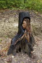 Wooden sculpture The Face of Urschel, Pfullinger Sagenweg, stories and legends, by woodsaw artist