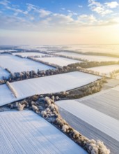 Bird Eye Perspective of Frost Covered Farmland. Seasonal Agricultural Scenery, winter and autumn