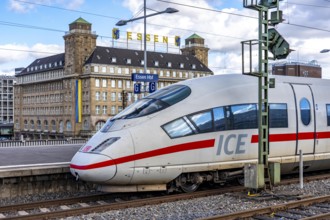 ICE train on track 2 in Essen main station, view of the city center, Handelshof building with Essen