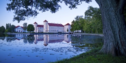 Rheinsberg Castle, lakeside with Lake Grienerick at night, prime example of Friederician Rococo,