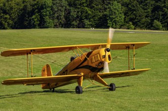 A biplane Bücker Bü 131 Jungmann with registration SP-YPZ during a flight demonstration as part of