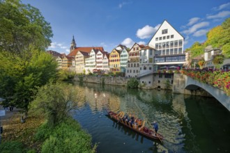 Historic houses on the Neckar front, the Neckar river with poking and water reflection, old town of