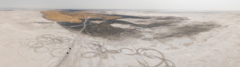 Aerial view, tire tracks on a salt pan, arid landscape, Botswana
