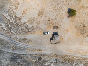 Aerial view, top-down view, off-road car driving on a salt pan, arid landscape, Botswana