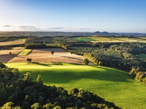Fields and Farms over River Teviot and Minto Crags from a drone, Roxburghshire, Scottish Borders,