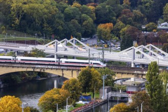 Bridges across the Neckar in Bad Cannstatt with Rosenstein Park. The ICE is still running on the