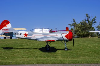 A Jakovlev Jak-52 with registration LY-HLZ during a flight demonstration as part of an air show on