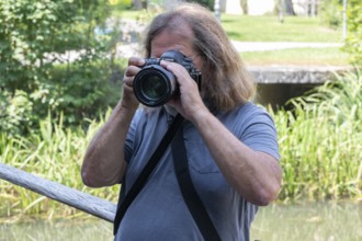 Photographer taking pictures, Amberg, Upper Palatinate, Bavaria, Germany