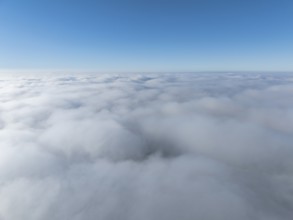 Aerial view, clouds of fog, fog cover seen from above, with clear blue sky, Germany