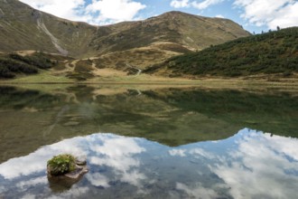 Schlappoldkopf and Söllerkopf are reflected in Schlappoldsee, Fellhorn, Oberstdorf, Oberallgäu,