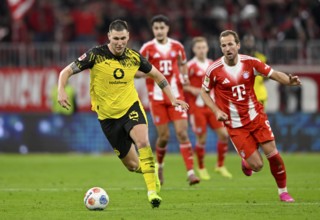 Niklas Süle Borussia Dortmund BVB (25) Ball action Harry Kane FC Bayern Munich FCB (09) German