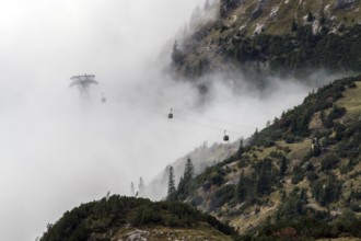 Pillars and cabins of the Nebelhorn Railway in the fog, Oberstdorf, Oberallgäu, Allgäu, Bavaria,