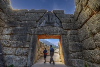 HDR, sky changed, couple walking through a huge stone gate, lion gate, Mycenae, archaeological