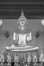Buddha statue with Bhumispara mudra, Buddha Gautama at the moment of enlightenment, in front of it