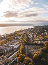 Aerial view of a lakeside town in autumn weather with beautiful clouds and buildings, Überlingen,