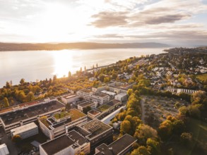 An aerial view of a waterside city surrounded by an autumn landscape, Überlingen, Lake Constance,