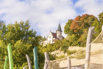 Old castle surrounded by autumn trees and blue sky, Überlingen, Lake Constance, Germany
