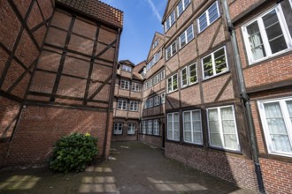 Facades of the historic brick buildings, inner courtyard, view over the city, Peterstraße,