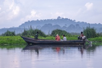 Boat with tourists in Mabamba Swamp, tourists photographing birds, Mabamba Swamp, Lake Victoria,