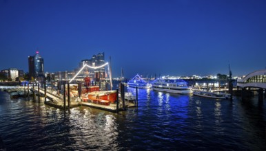 View of illuminated ships on the Elbe promenade with restaurant Das Feuerschiff LV 13, City