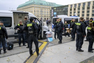 Arrest of New Generation activists on Pariser Platz after symbolic house search at the Stiftung