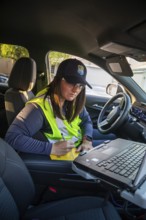 Las Vegas, Nevada - Devyn Choltko, a water waste investigator, patrols a residential neighborhood