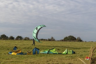 Kitesurfer packing up, Falshöft, Pommerby, Schleswig-Holstein, Germany