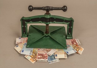 Euro banknotes in a press. Symbolic image for currency problems