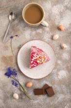 Chocolate cake on brown concrete background, cup of coffee, top view, flat lay, close up