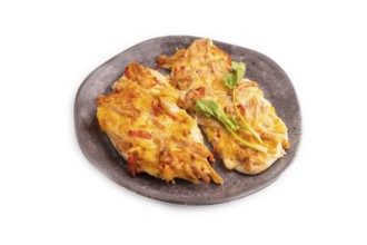 Baked chicken meat with cheese and tomatoes isolated on white background. side view, close up