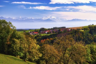 Village of Juriens in the Vaud Jura with view of Mont Blanc, haze over Lake Geneva, autumn-coloured