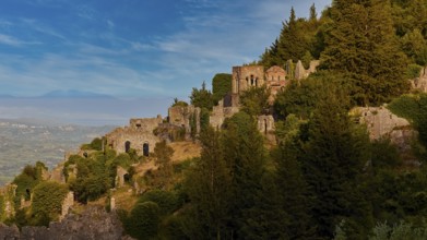 Church of Agia Sophia from the 14th century AD, ruins and trees cover a sunny hillside with a clear