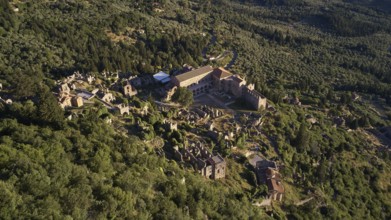 Aerial view of the Byzantine Palace of Mystras, with surrounding ruins in green landscape, Mystras,