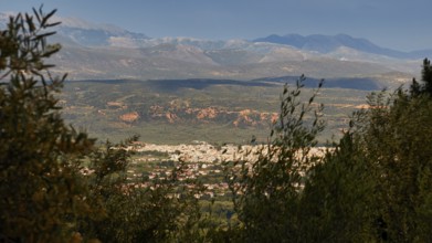 View of a valley, framed by high mountains and dense vegetation, view of Sparta, Mystras, Mistra,