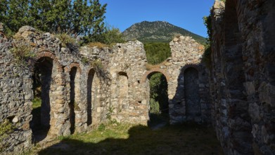 Stone ruins with arched passageways and mountain in the background, Mystras, Mistra, UNESCO World