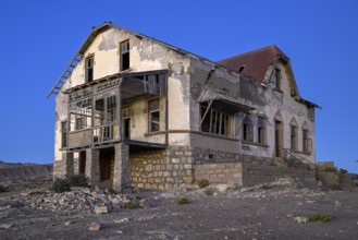 Dilapidated accountant's house in the desert sand, blue hour, Kolmanskop, near Lüderitz, Karas