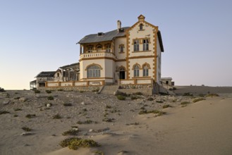 Mine manager's house in the desert sand, Kolmanskop, near Lüderitz, Karas Region, Namibia