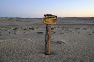 Restricted Area sign in the desert sand, Kolmanskop, diamond restricted area, near Lüderitz, Karas
