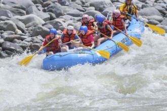A group of people white water rafting, Costa Rica, Central America