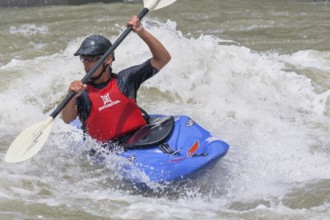 Young man kayaking in river, Costa Rica, Central America