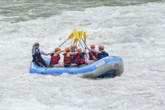 People celebrating white water rafting adventure, Costa Rica, Central America