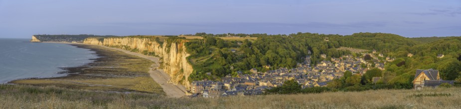 View of the village and the chalk cliffs in the evening light, Yport, Département Seine-Maritime,
